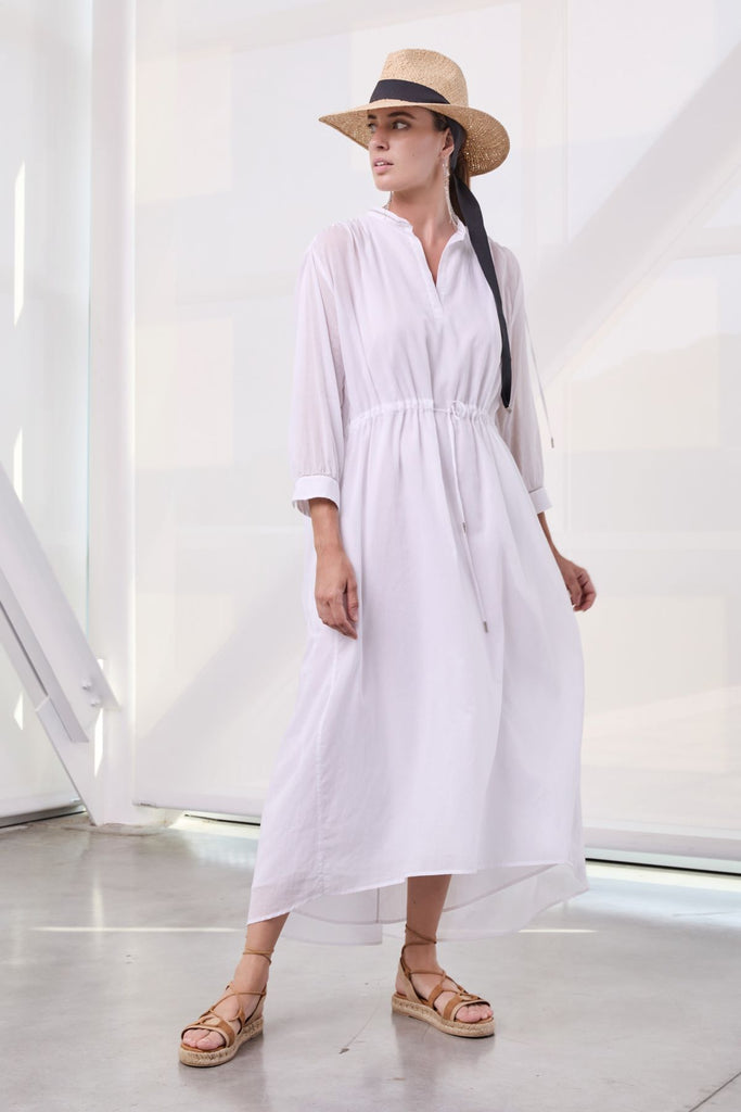 Ample gathered tunic with drawstring in light pure cotton gauze with diamond cut chain trim on wrists  