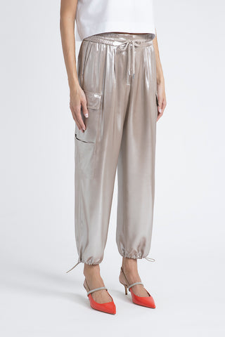 Baggy trousers in flowing silver laminated viscose twill  