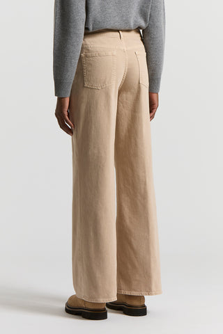 Garment-dyed denim jeans
