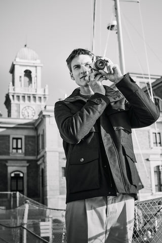 male model taking a picture in black and white