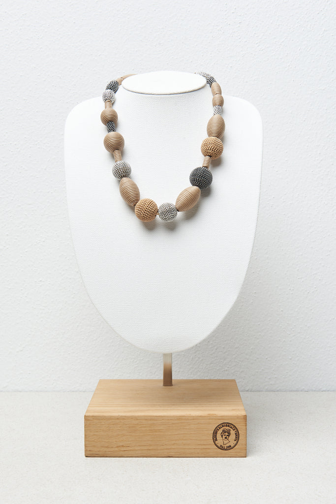 Necklace with wooden, metal and cotton yarn beads  