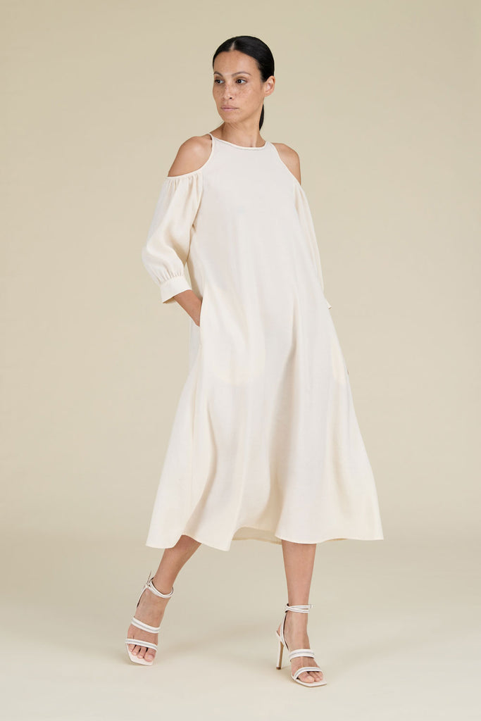 Flared dress in fluid modal with show off shoulders illuminated by diamond cut chain trim  