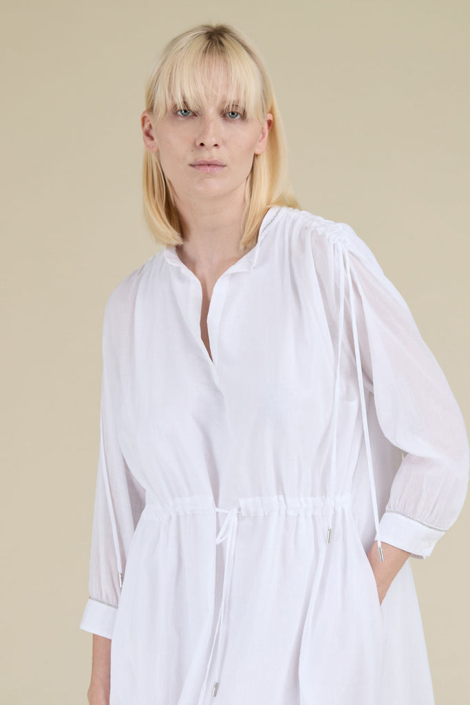 Ample gathered tunic with drawstring in light pure cotton gauze with diamond cut chain trim on wrists  