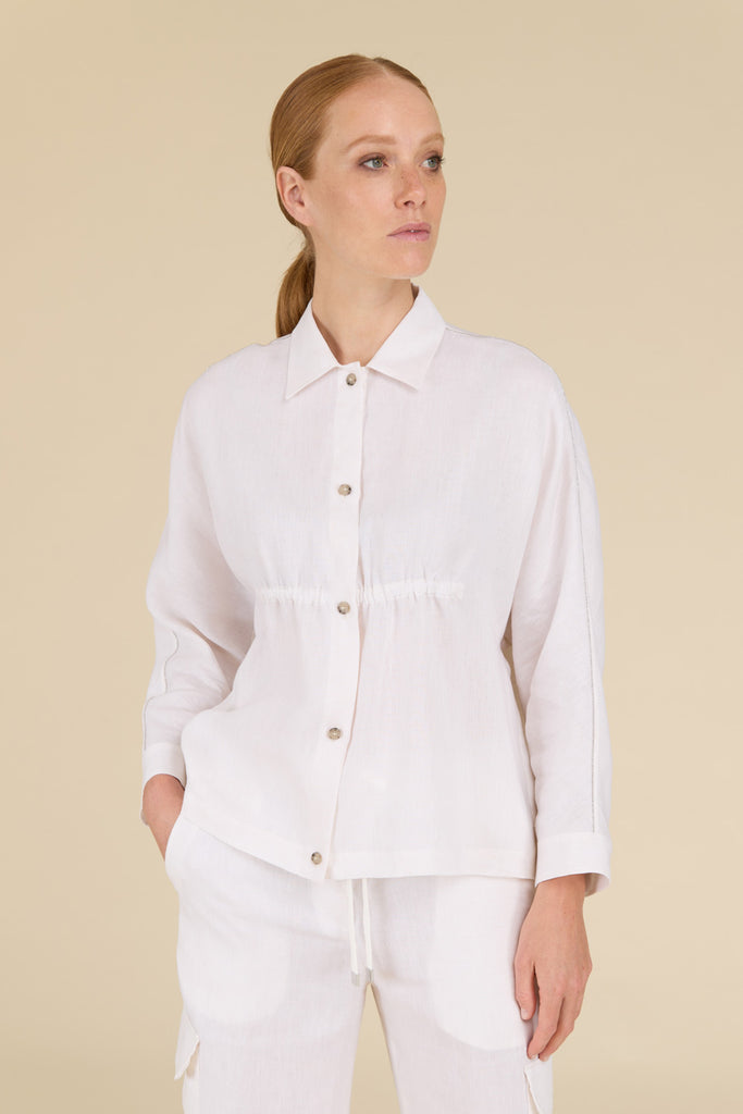 Shirt with gathered front in light pure linen  with diamond cut chain trim along the sleeves  
