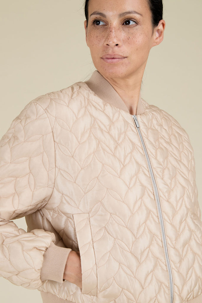 Quilted bomber jacket in luminous glass-effect ripstop with knitted details  