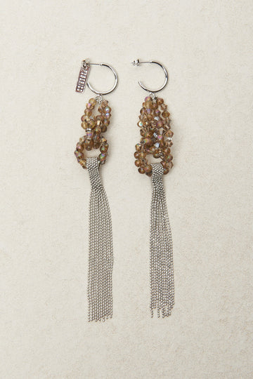 Earrings with cascade of Punto Luce diamond cut chain inserted in concentric crystal elements  
